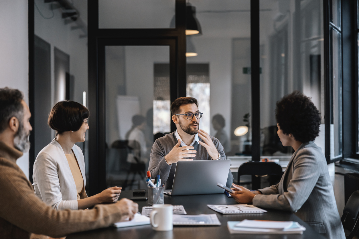 A dedicated mentor is explaining mentees importance of project while sitting at the boardroom in corporate firm. A dedicated mentor is explaining mentees importance of project while sitting at the boardroom in corporate firm.
